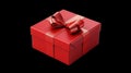 A Red gift box wrapped for Christmas birthday or Valentines presents with red ribbon bows isolated against a transparent Royalty Free Stock Photo