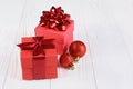 Red gift boxes with bows and Christmas tree balls Royalty Free Stock Photo