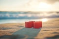 Red Gift Boxes on Sandy Beach Royalty Free Stock Photo