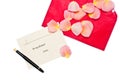Red gift note envelope with pen next to it
