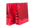 RED GIFT PACKAGE ON WHITE BACKGROUND. Colourful paper shopping bags isolated on white Royalty Free Stock Photo