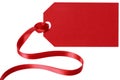Red gift tag with ribbon cut out white background Royalty Free Stock Photo