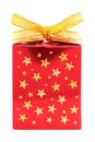 Red gift wrapped present with golden stars