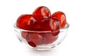 Red glace cherries in glass bowl isolated on white. Royalty Free Stock Photo