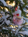 Red glass ball on snow-covered branch of christmas tree Royalty Free Stock Photo