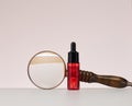 Red glass bottle with pipette for cosmetics, oils and serum. Advertising and product promotion Royalty Free Stock Photo