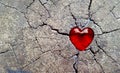 Red Glass Heart on Cracked Timber