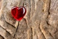 Red Glass Heart on soft focus timber background