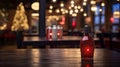 Red glass lamp on a wooden table in a restaurant with Christmas lights in the background Royalty Free Stock Photo