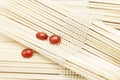 Red Glass Pebbles On Blurred Wooden Sets. Spa Wellness Concept