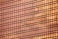 Red glass skyscraper wall surface close up, modern business center view, financial city district, commercial downtown design