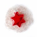 Red glass star, bedded in an angel hair nest, a Christmas decoration Royalty Free Stock Photo