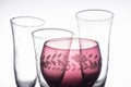 A red glass with transparent glasses around Royalty Free Stock Photo
