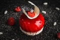 Red glazed cake decorated with white chocolate and raspberry Royalty Free Stock Photo
