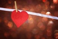 Red glitter heart hang over brown bokeh background