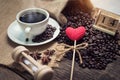 Red glitter hearts on coffee beans Royalty Free Stock Photo