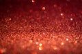 Red glitter lights. Shiny sparkles, bokeh effects, glowing surface. Selective focus, christmas abstract background Royalty Free Stock Photo