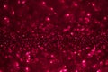 Red glitter magic background. Defocused light and free focused place for your design.