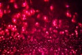 Red glitter magic background. Defocused light and free focused place for your design.