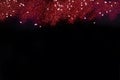 Red glitter with stars on black abstract background for Valentines, birthday, anniversary, wedding, new year and Christmas Royalty Free Stock Photo