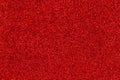 Red glitter textured paper closeup background