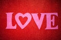 Red glittery background with pink letters, love,Valentine`s Day, texture abstract background, suitable for ads, insert text, Royalty Free Stock Photo