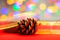 Red glittery decoration in a colorful Christmas composition isolated on background of blurred lights Royalty Free Stock Photo