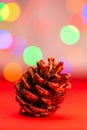 Red glittery decoration in a colorful Christmas composition isolated on background of blurred lights Royalty Free Stock Photo
