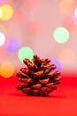 Red glittery decoration in a colorful Christmas composition isolated on background of blurred lights Royalty Free Stock Photo