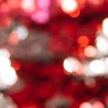 Red glittery sequin background with blurred focus