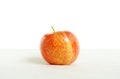 Red glossy apple on white background with clean top side for news article. Template healthy food with eco fruit. Close-up