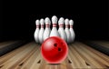 Red glossy ball rolling on bowling alley line to ten placed in order white bowling pins. Royalty Free Stock Photo