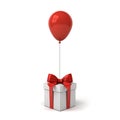 Red glossy balloon tied to gift box or present box with red ribbon bow isolated over white background Royalty Free Stock Photo