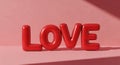 Red glossy love letters casting shadows on a soft pink surface Royalty Free Stock Photo