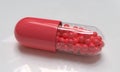 Red glossy medical pill. Capsule mockup. Pharmacy concept