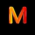 Letter M of plastic orange shining font isolated on black background - 3D illustration of symbols Royalty Free Stock Photo