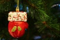 Red Glove of Santa Shaped Ornament Hanging on the Christmas tree Royalty Free Stock Photo