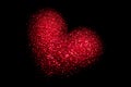 Red glowing heart on a black background. Happy Valentine`s Day