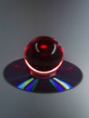 Red glowy glass ball on CD