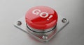 Red \' GO!\' Button Mounted on a Brushed Metal Surface go button start button Royalty Free Stock Photo