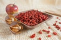 Red goji beans in a wooden cup - country style