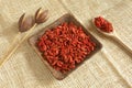 Red goji beans in a wooden cup - country style