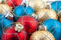 Red, gold and blue Christmas balls, Christmas toy background. Royalty Free Stock Photo