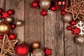 Red and gold Christmas ornament double corner border, top view on a wood background Royalty Free Stock Photo