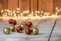Red and gold Christmas ornaments on snowy background Royalty Free Stock Photo