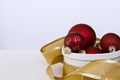 Red & Gold Christmas Ornaments Wrapped in Gold Ribbon Royalty Free Stock Photo