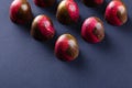 Red and gold colored bonbons on black background Royalty Free Stock Photo