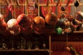 Red and gold colored glass christmas ornaments hanging in a kiosk at Christmas market - Weihnachtsmarkt - in Stuttgart, Germany