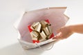 Red gold gift box present inside paper bag isolated Royalty Free Stock Photo