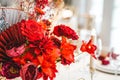 Red gold golden color decor, floral arrangement. Festive bouquet, table decoration. Traditional Chinese New Year party Royalty Free Stock Photo